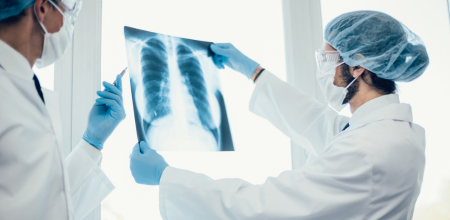 "Healthcare Healthcare professional examining an x-ray